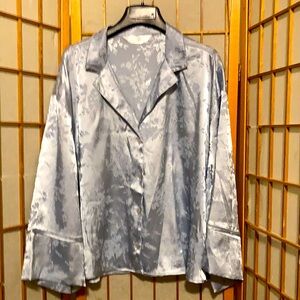 Primary. Soft blue blouse. L. 25” long. 27” under arms.